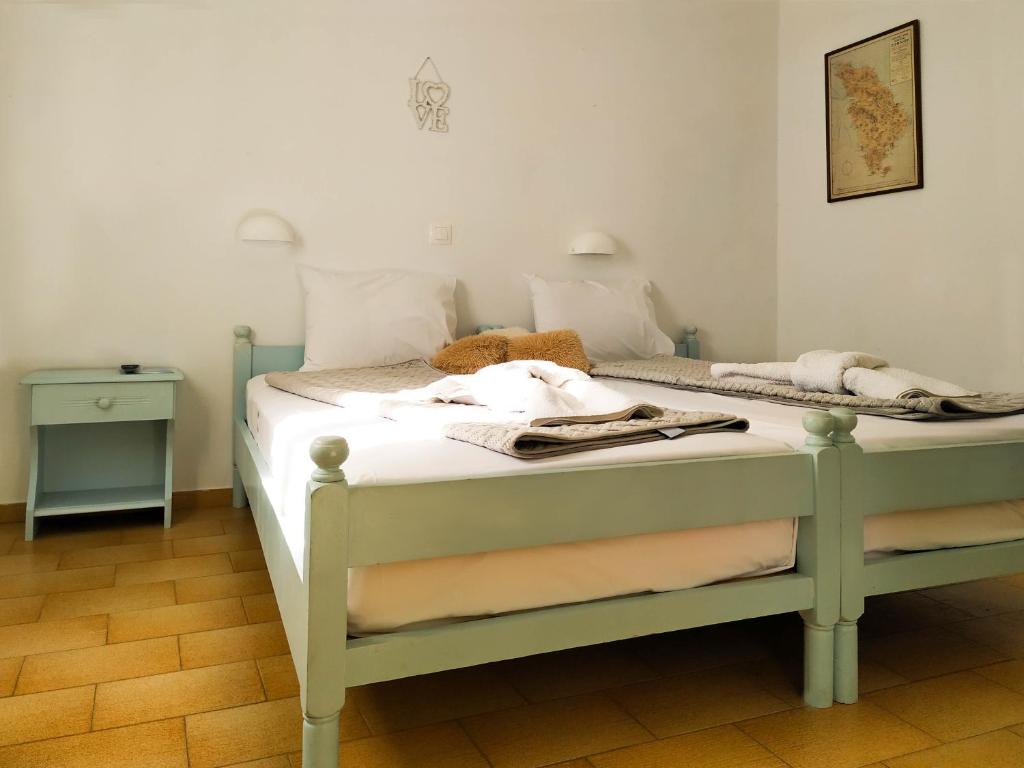 Postel nebo postele na pokoji v ubytování Το Κατἑ