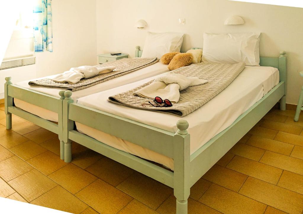 Postel nebo postele na pokoji v ubytování Το Κατἑ