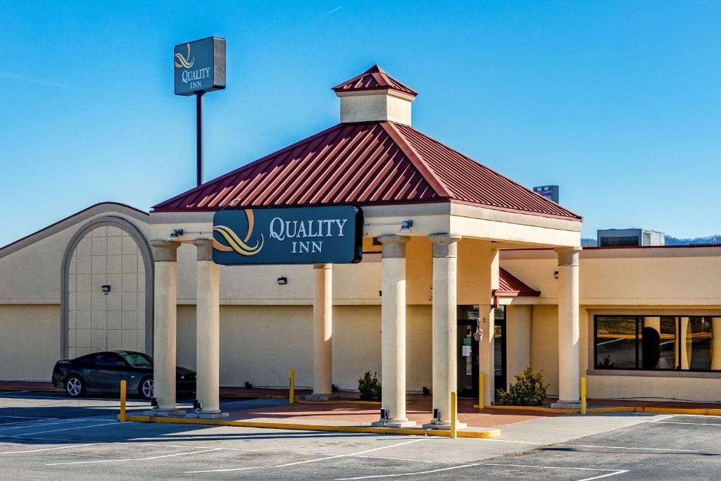 a building with a sign for a quality inn at Quality Inn in Newport