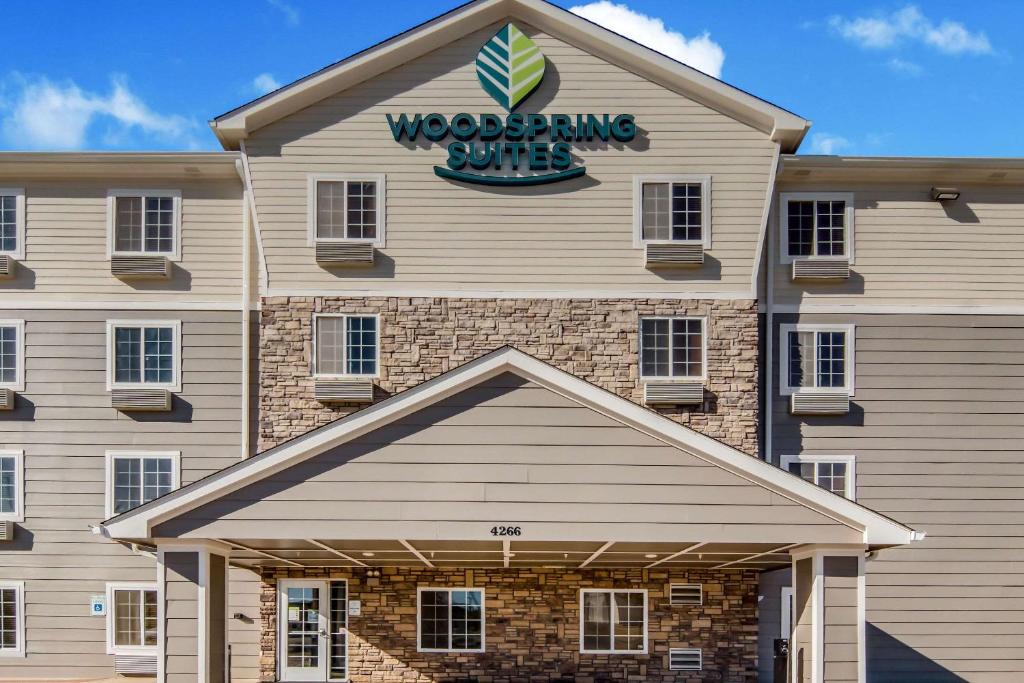 a exterior view of a woodworking building at WoodSpring Suites Abilene in Abilene