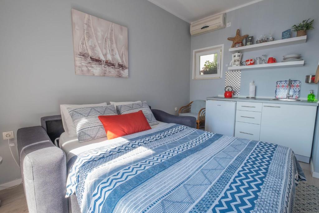 Postel nebo postele na pokoji v ubytování Apartmani Villa Mila
