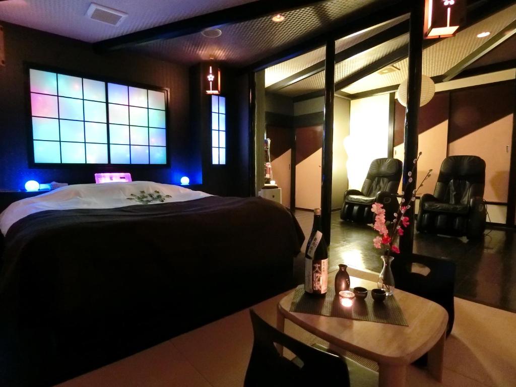 Postel nebo postele na pokoji v ubytování Kasama Shizu ( Love Hotel )