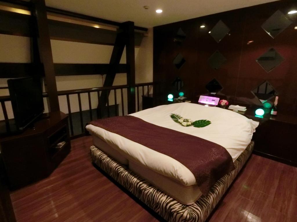 Postel nebo postele na pokoji v ubytování Kasama Shizu ( Love Hotel )