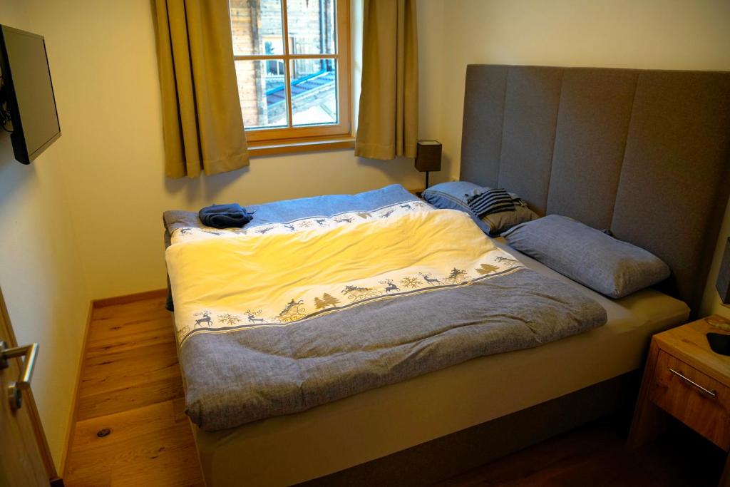 Postel nebo postele na pokoji v ubytování Alpin Residenzen Panoramabahn by Alpina-Holiday