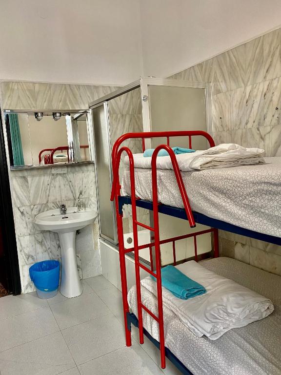 Cama o camas de una habitación en Barbieri Sol Hostel