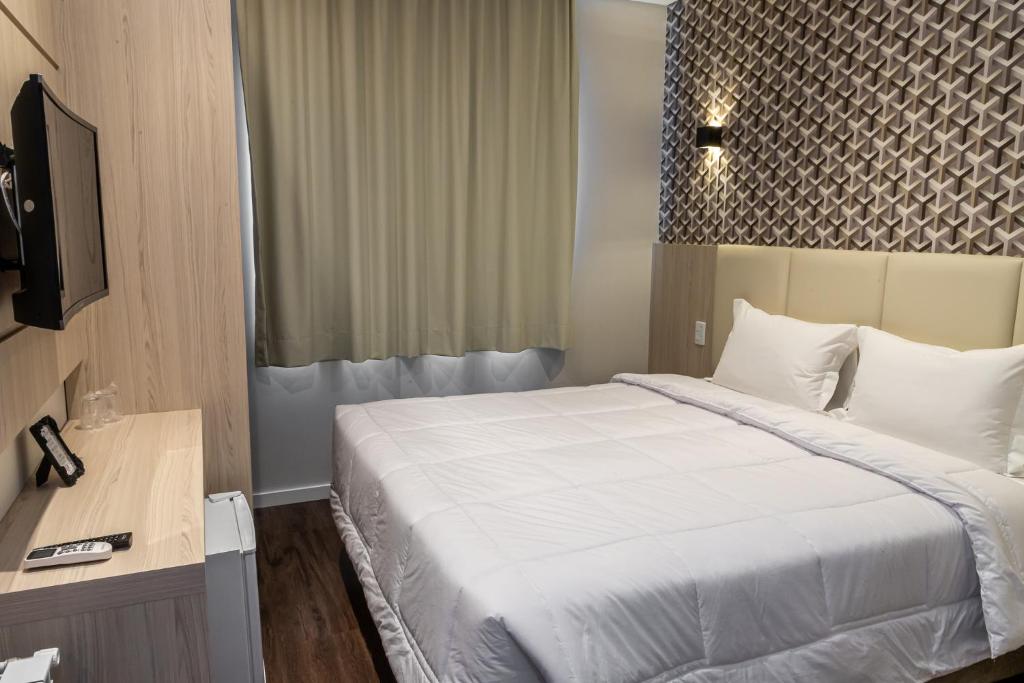Cama ou camas em um quarto em Colina Lagos Hotel