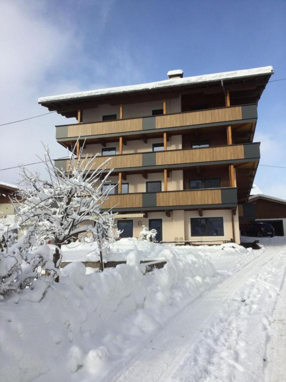 a building with snow in front of it at Holiday Home Eberharter by Interhome in Mayrhofen