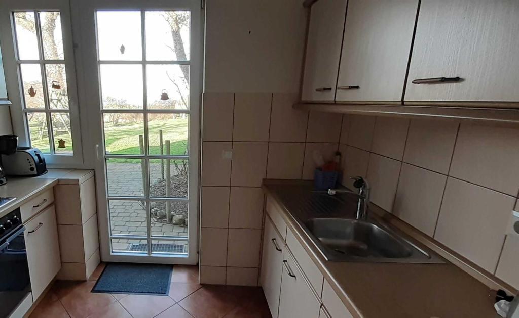 Kuchyň nebo kuchyňský kout v ubytování Ferienhaus Geltinger Birk