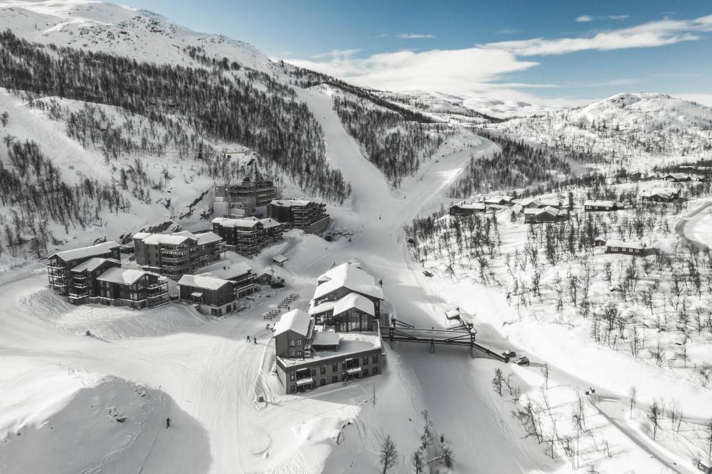 an aerial view of a resort in the snow at Skigaarden in Hemsedal