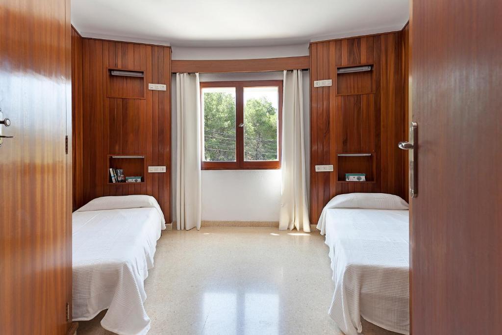 Postel nebo postele na pokoji v ubytování Villa Son Veri d'Alt