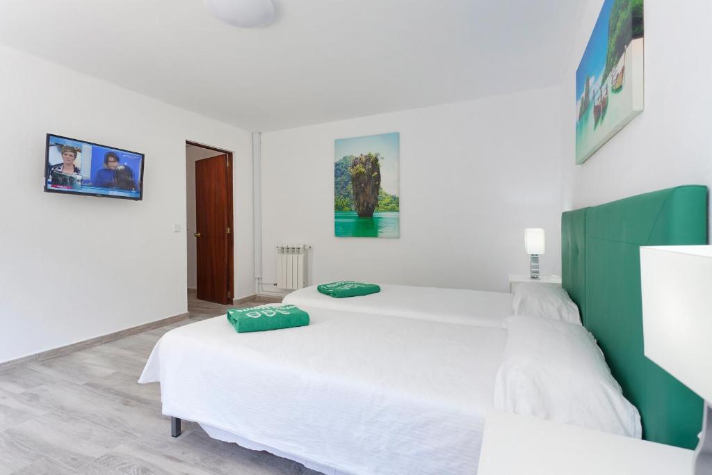 Posteľ alebo postele v izbe v ubytovaní Villa Son Veri Miramar