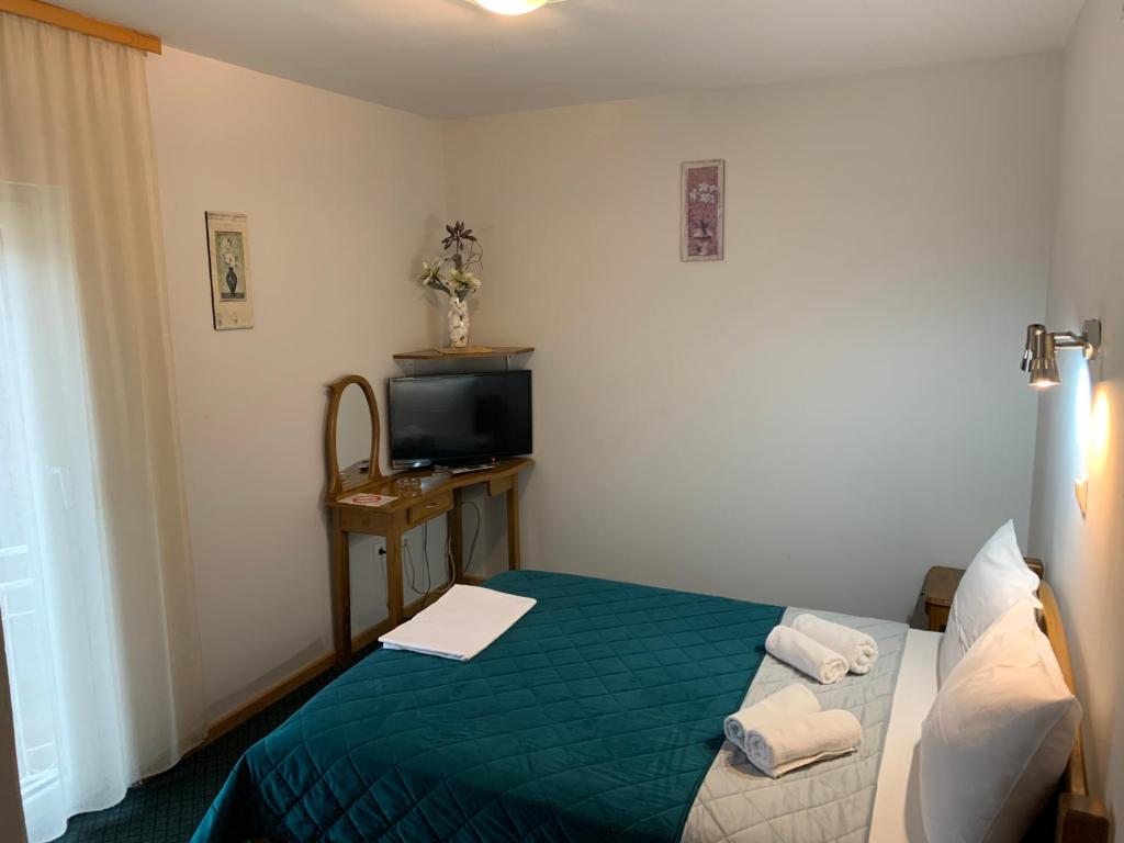 Postel nebo postele na pokoji v ubytování Garni hotel Vir