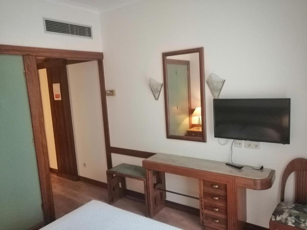 TV a/nebo společenská místnost v ubytování Hotel Universal