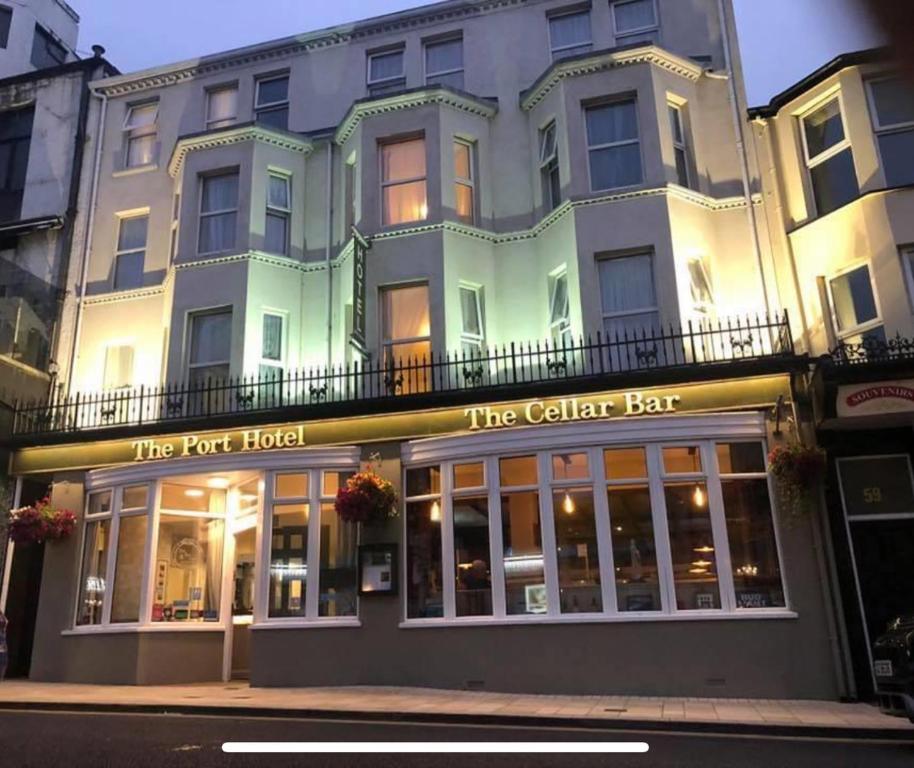 a building with a sign that reads the vet hotel at The Port Hotel in Portrush