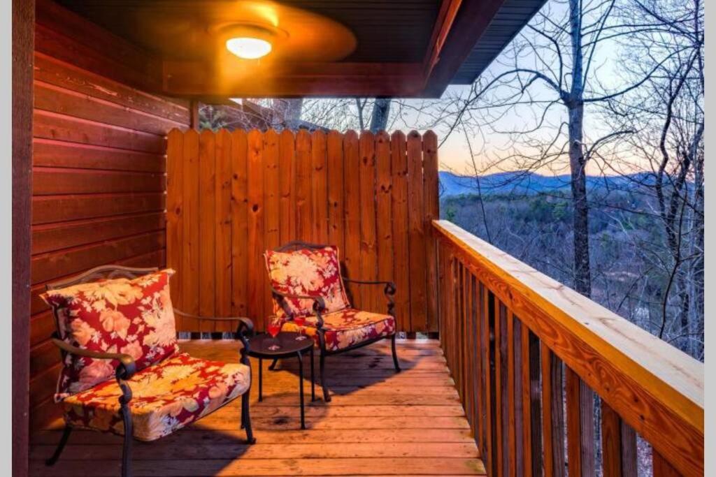 two chairs on a porch with a view of the mountains at Great View! Pool Table,Hot Tub,Privacy,Fireplace in Sevierville