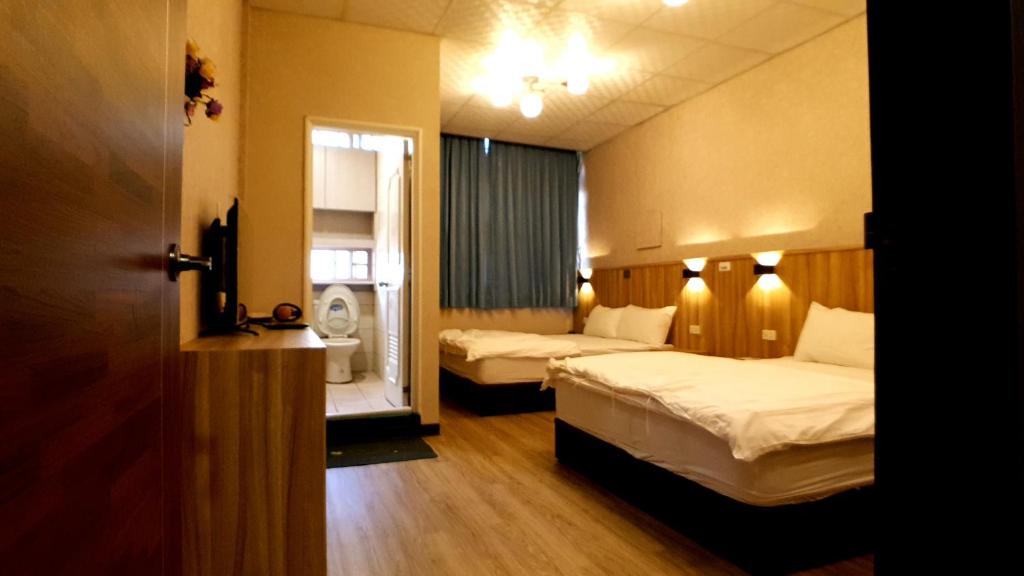 Postel nebo postele na pokoji v ubytování Duo Yuan Hua B&B