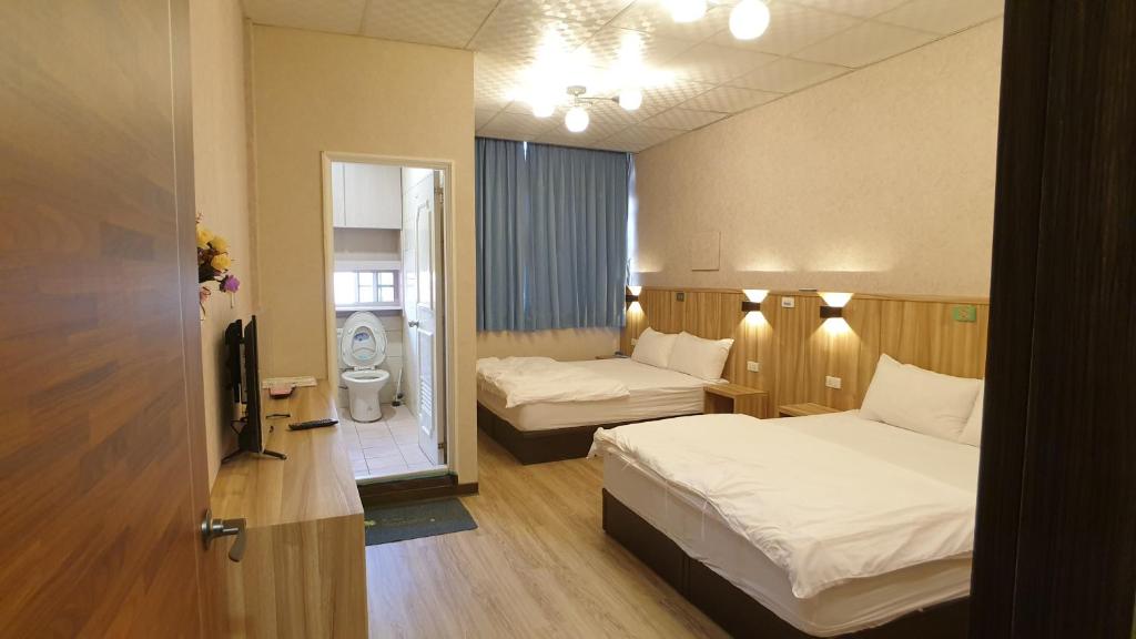 Postel nebo postele na pokoji v ubytování Duo Yuan Hua B&B