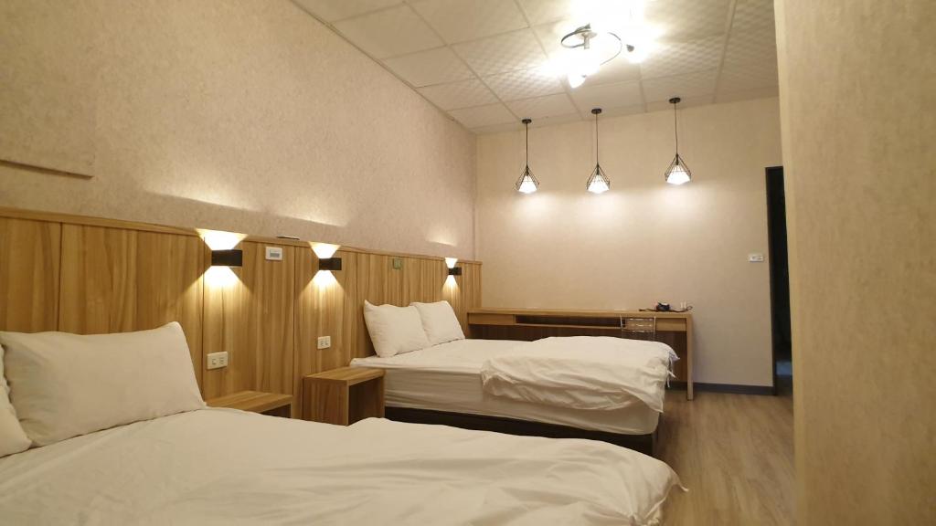 Postel nebo postele na pokoji v ubytování Duo Yuan Hua B&B