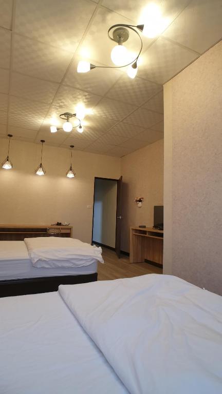 Postel nebo postele na pokoji v ubytování Duo Yuan Hua B&B