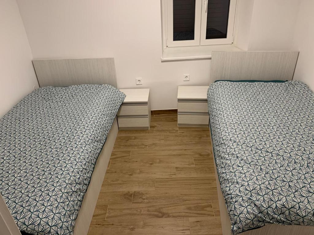Postel nebo postele na pokoji v ubytování Apartma Sinitus