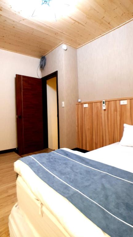 Postel nebo postele na pokoji v ubytování Duo Yuan Hua B&B
