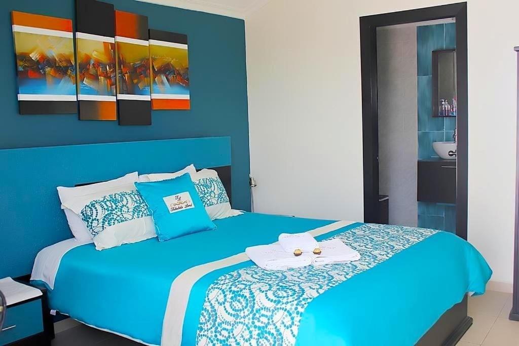 Postel nebo postele na pokoji v ubytování Hotel Tababela Land