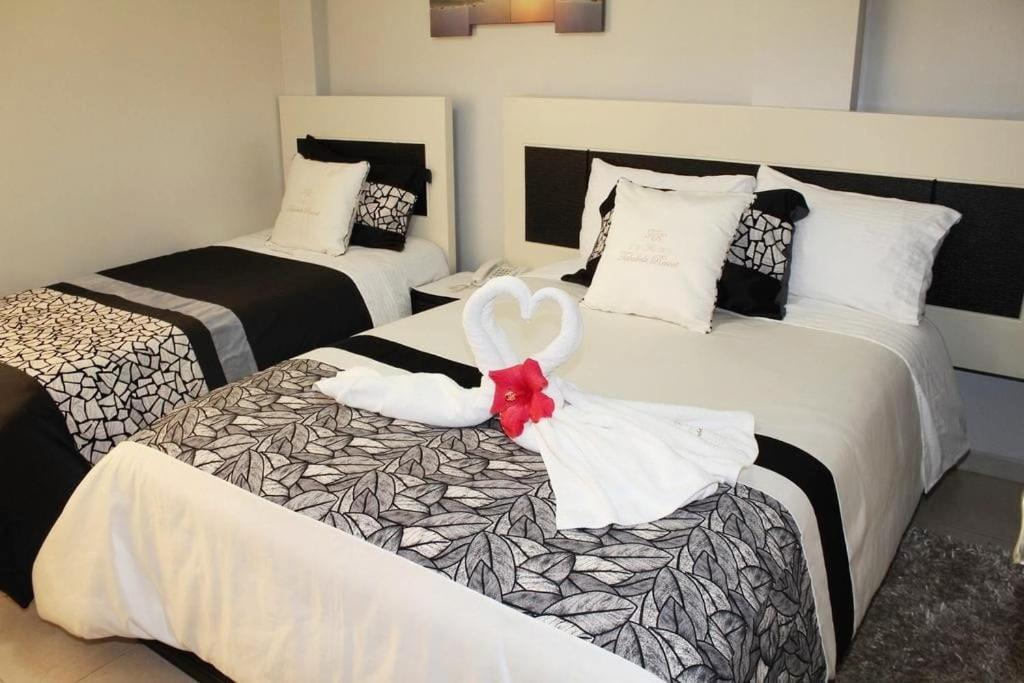 Postel nebo postele na pokoji v ubytování Hotel Tababela Land