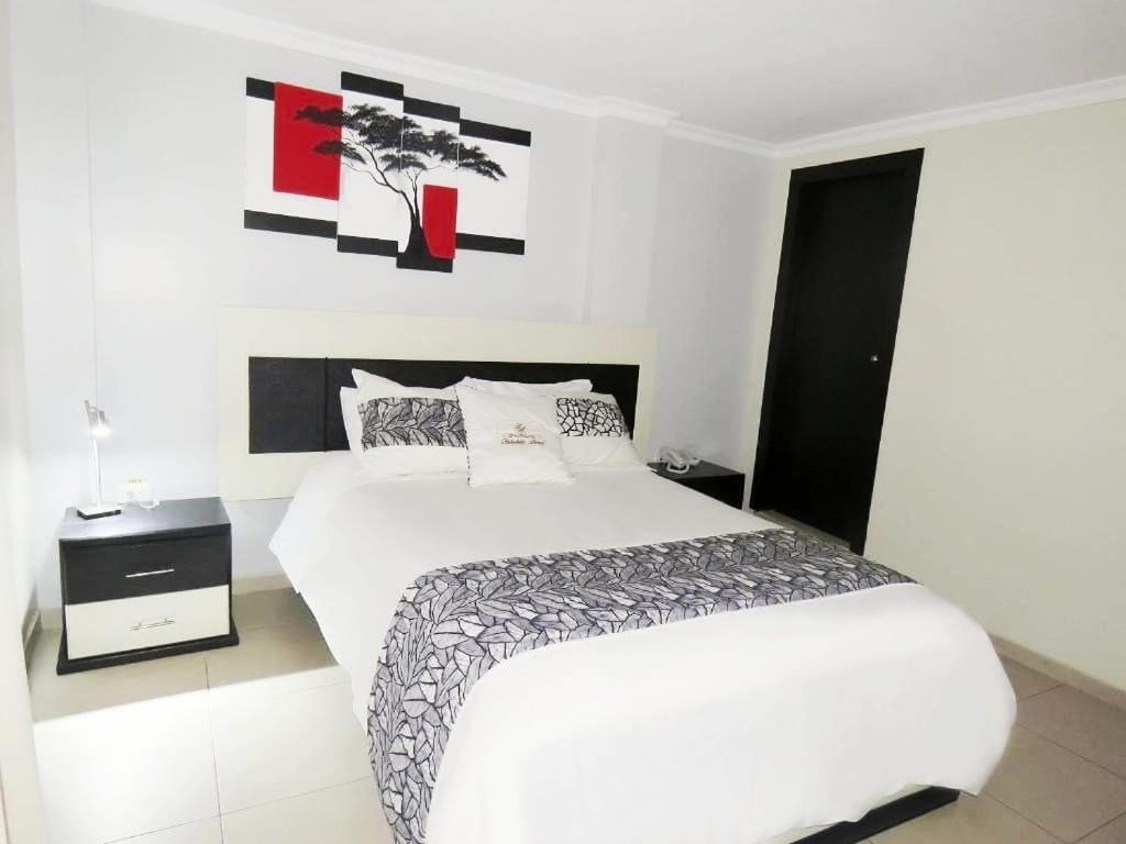 Postel nebo postele na pokoji v ubytování Hotel Tababela Land