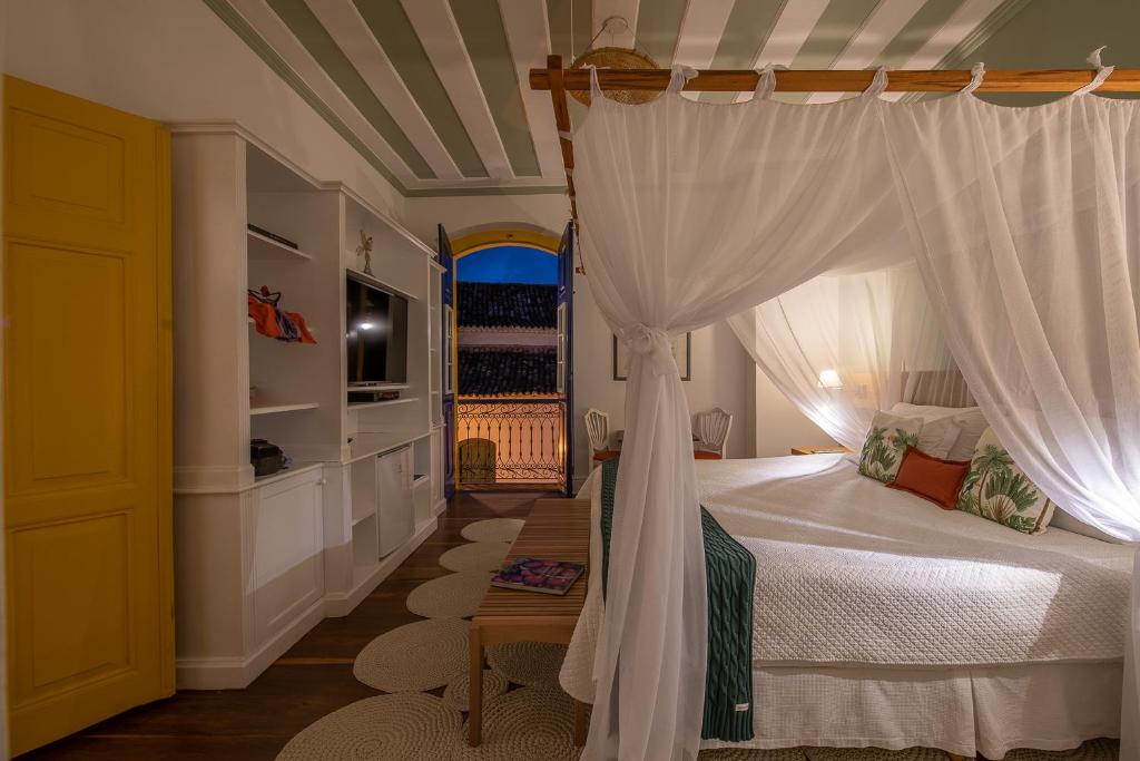 Postel nebo postele na pokoji v ubytování Sandi Hotel