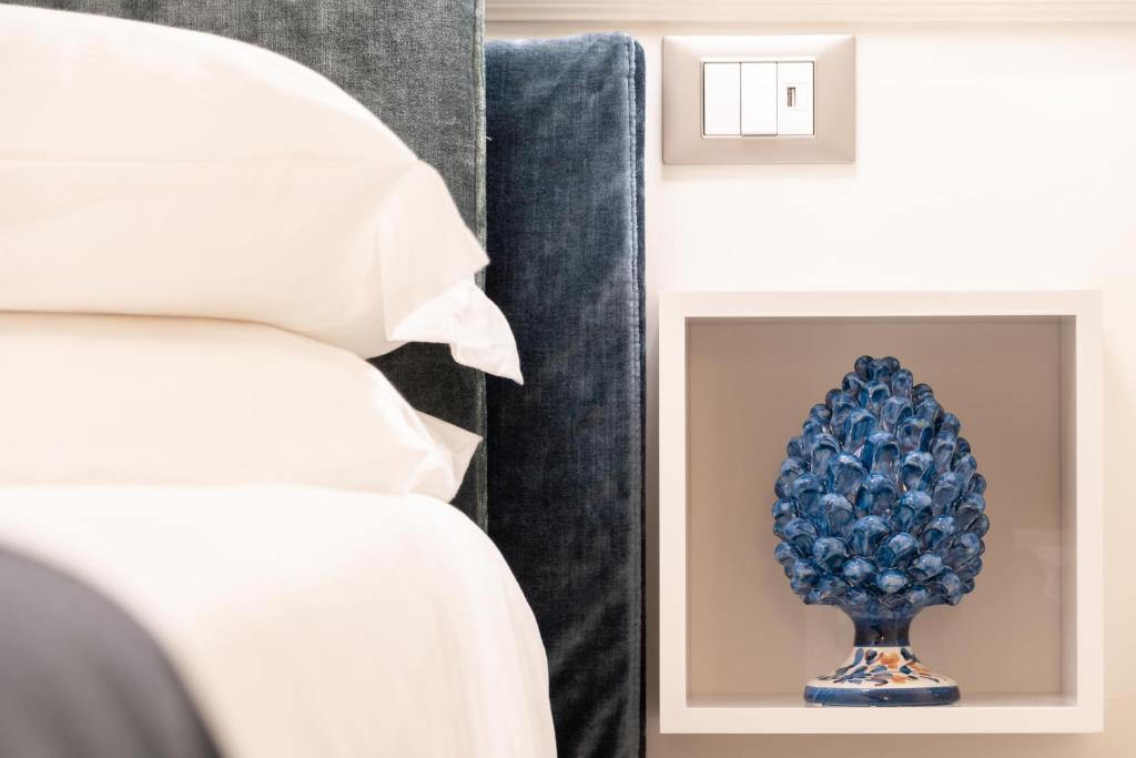 Postel nebo postele na pokoji v ubytování Longo Suites