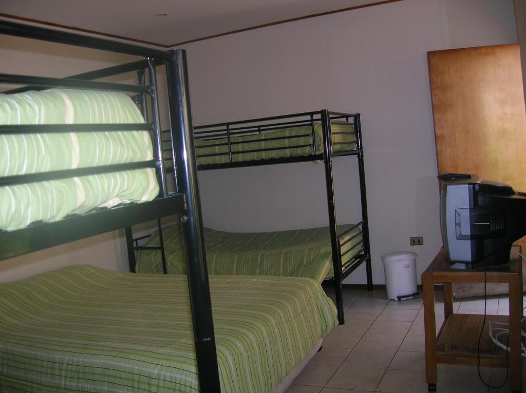 Postel nebo postele na pokoji v ubytování Iquique Beachfront