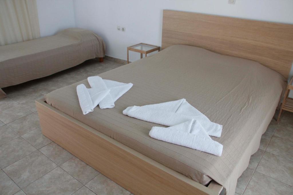Postel nebo postele na pokoji v ubytování Milios Studios