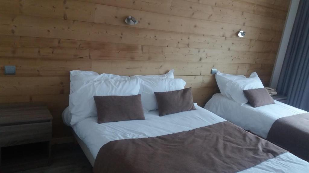 Postel nebo postele na pokoji v ubytování Aiguille Noire