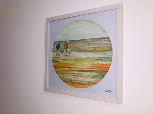 a framed picture of two birds on a beach at Townhouse @ Corporation Street Stoke in Stoke on Trent