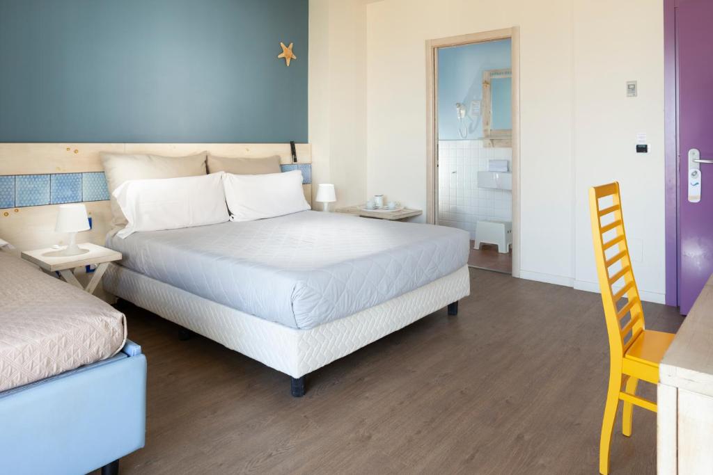 Postel nebo postele na pokoji v ubytování Hotel LaMorosa