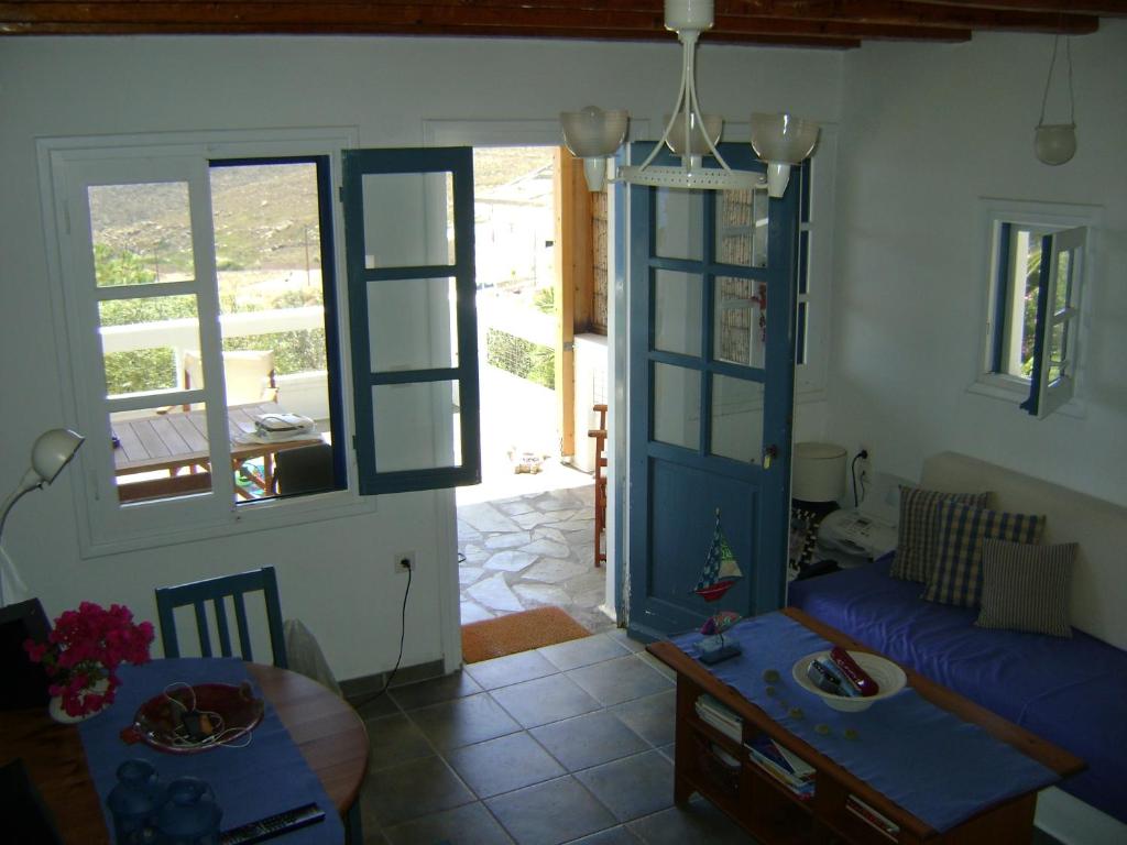 a living room with a couch and a table at Chez Semiramis The Sun Touch House for 8 persons 5'min from the beach in Rámos
