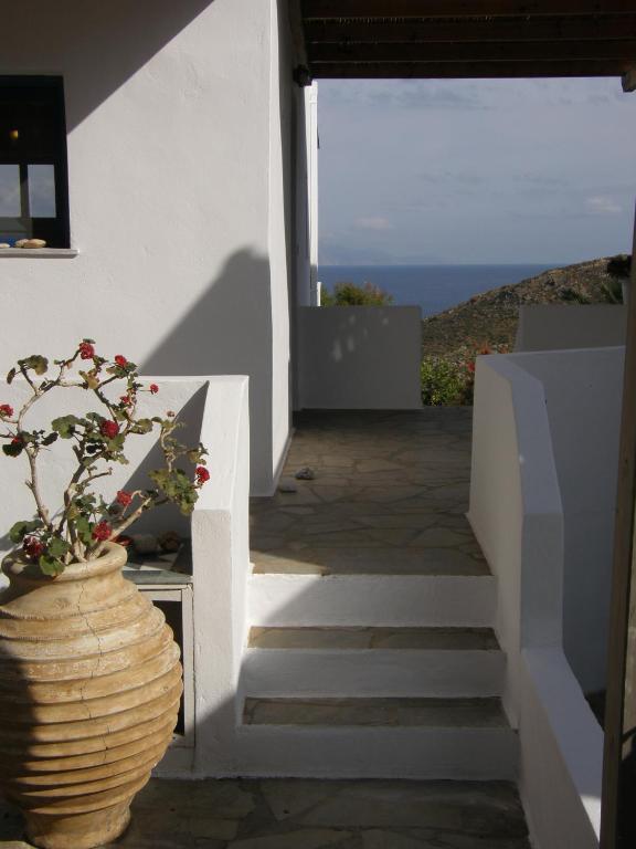 a stairway with a vase with a plant in it at Chez Semiramis The Sun Touch House for 8 persons 5'min from the beach in Rámos