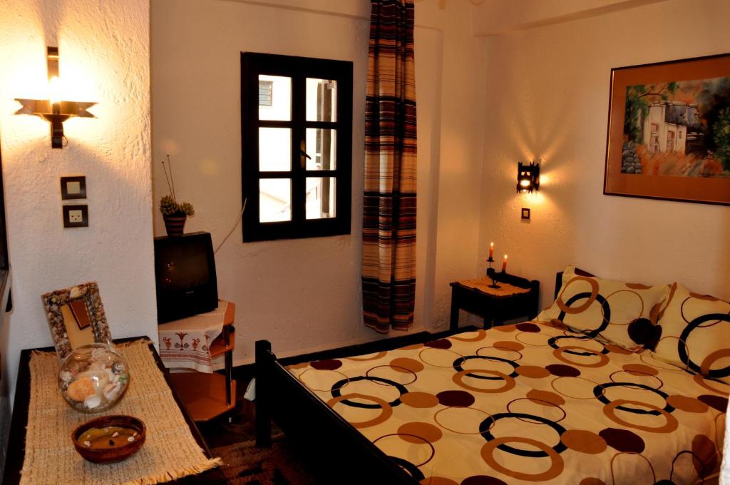 Postel nebo postele na pokoji v ubytování Heliotrope Apartments