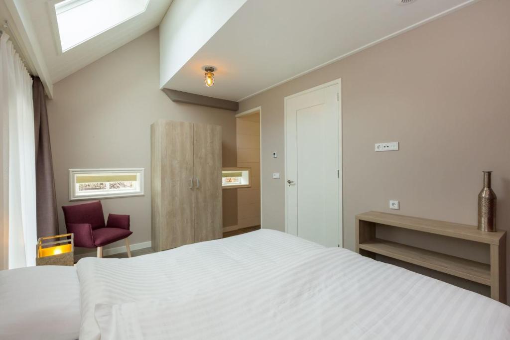 Postel nebo postele na pokoji v ubytování Vakantiewoning - Noordweg 56a Oostkapelle Comfort 4 personen
