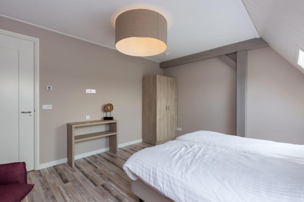 Postel nebo postele na pokoji v ubytování Vakantiewoning - Noordweg 56a Oostkapelle Comfort 4 personen