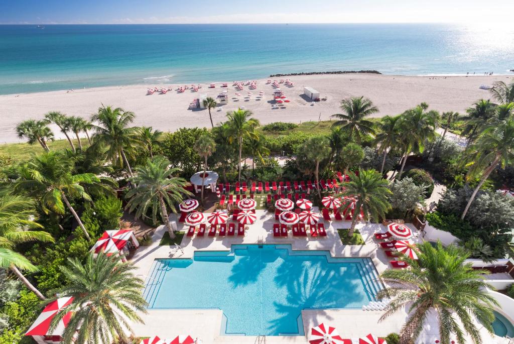 a beach filled with lots of colorful umbrellas at Faena Hotel Miami Beach in Miami Beach
