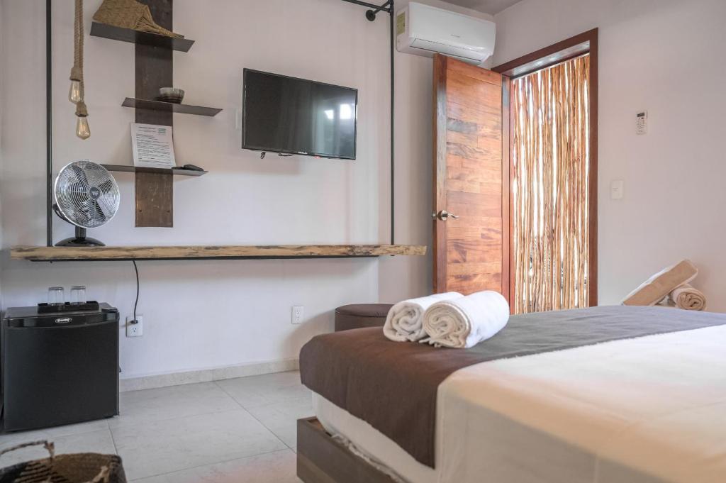 TV a/nebo společenská místnost v ubytování Agam Hotel