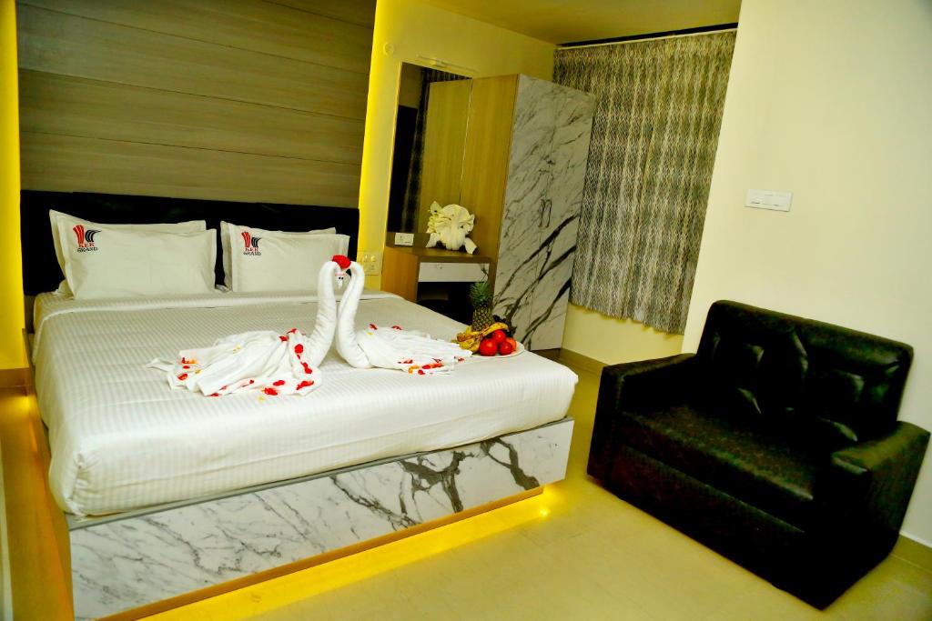 Postel nebo postele na pokoji v ubytování HOTEL KEK GRAND PARK