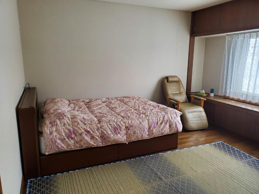 Postel nebo postele na pokoji v ubytování Guest House EBISAN