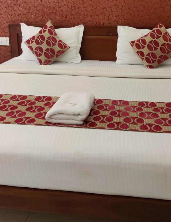 Postel nebo postele na pokoji v ubytování Hotel Hilite Inn