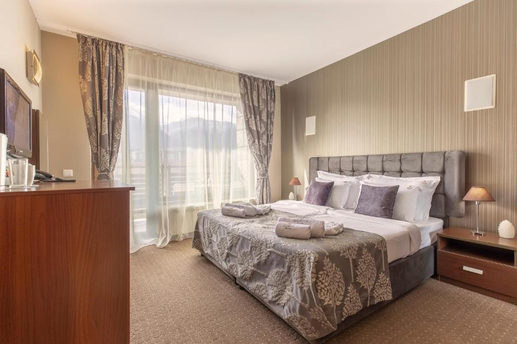 Postel nebo postele na pokoji v ubytování Murite Park Hotel