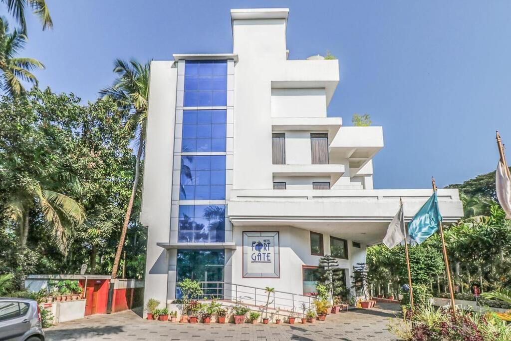 a white building with a lot of windows at Fort Gate Hotels & Resorts in Trichūr