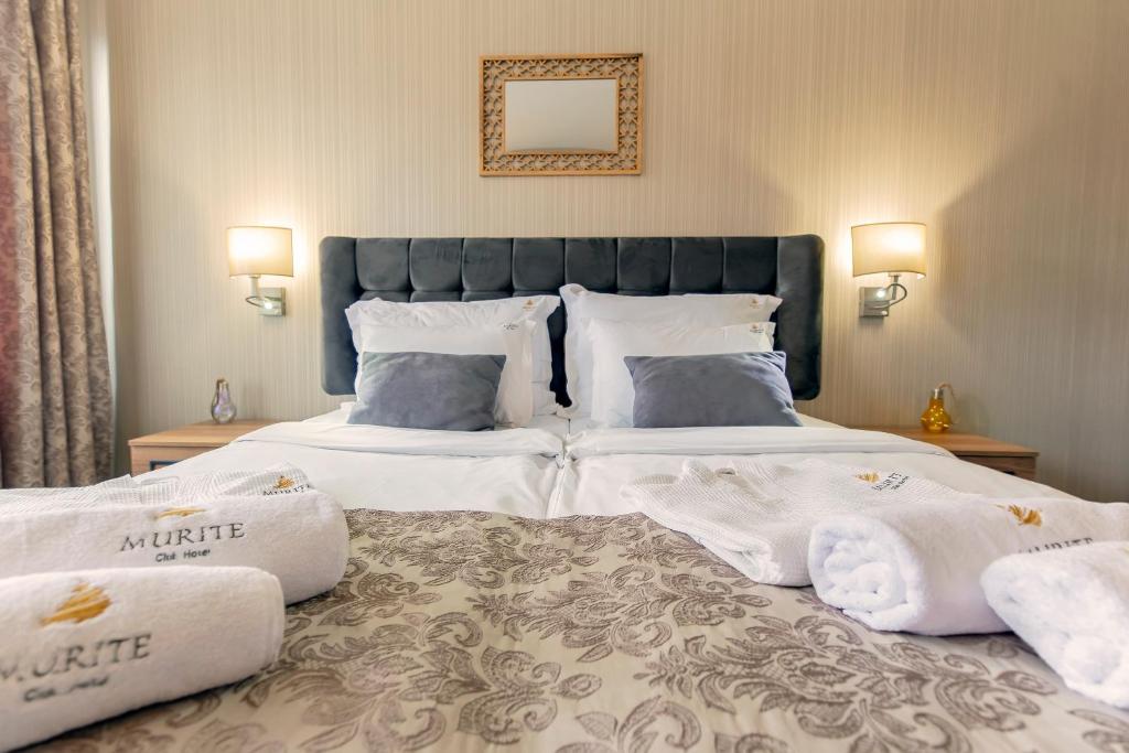 Postel nebo postele na pokoji v ubytování Murite Park Hotel