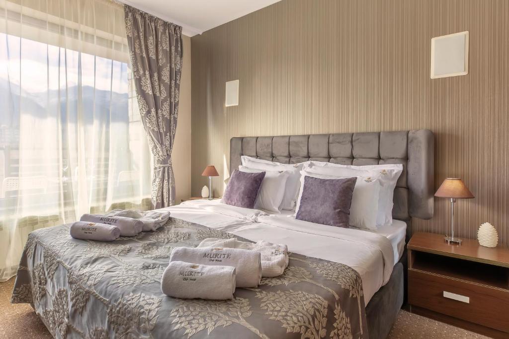 Postel nebo postele na pokoji v ubytování Murite Park Hotel