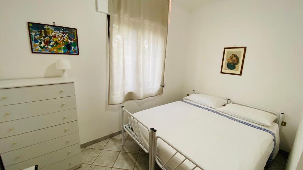 A bed or beds in a room at I Giardini Dell'Agave
